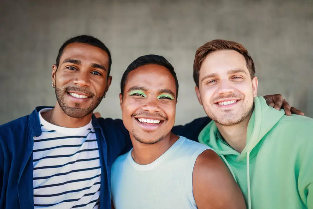 Diverse men smile on camera enjoy together. LGBT, gay, equality friendship concept