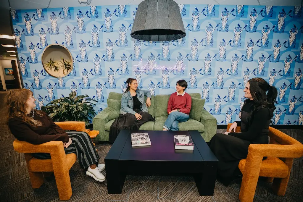 Group conversation in the lounge area at Chroma Wellness Center, an LGBTQIA+ affirming mental health and substance use treatment center.
