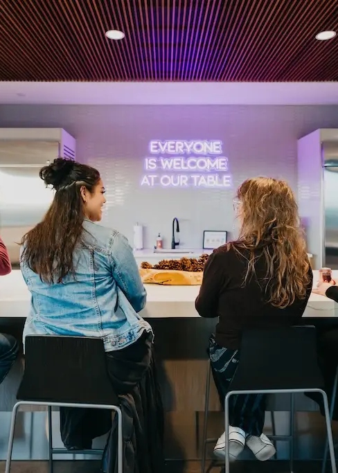 Clients connecting in a welcoming community space during a partial hospitalization program in Denver at Chroma Wellness Center