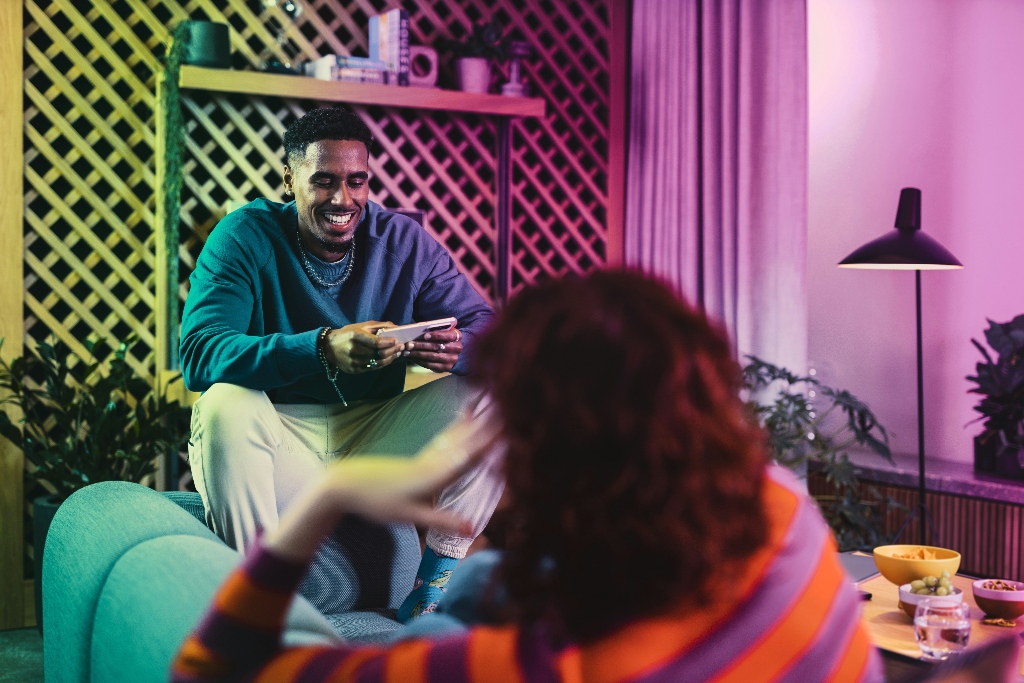 Young adults having a conversation in a relaxed social environment.