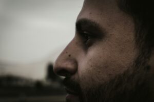 Close-up of a person's nose, representing the identification and detection of unusual or strong odors.